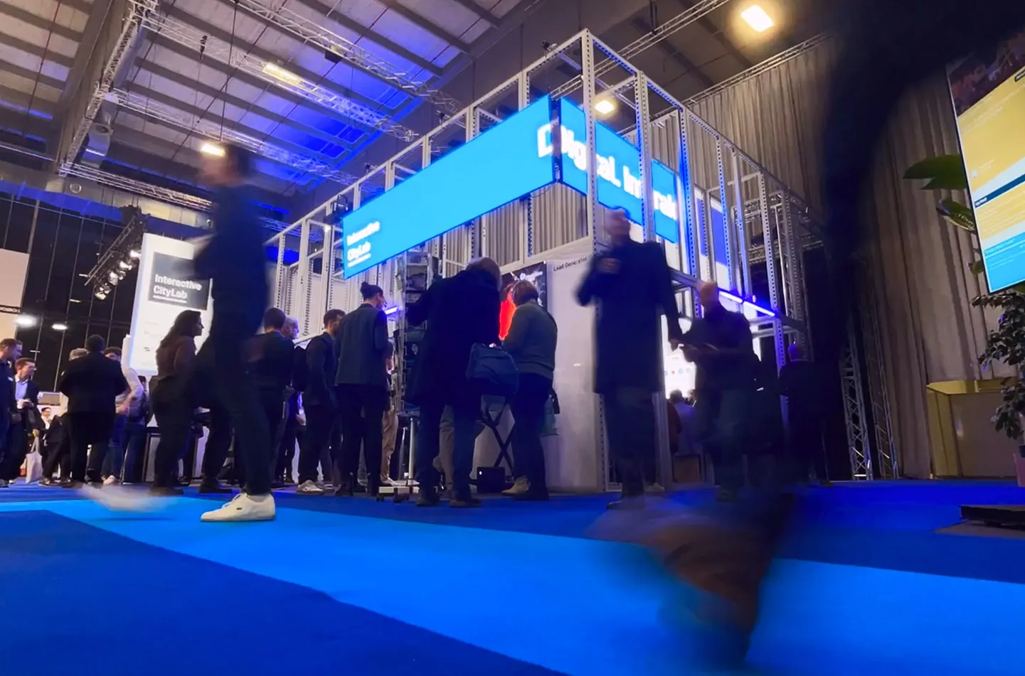 Interactive City Lab booth frame lit in blue at Smart Country Convention, Berlin